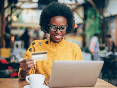 Woman shopping online with credit card